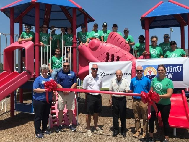 IP and United Way volunteers host a ribbon cutting of the Born Learning Trail at West Craven Park in Vanceboro, N.C.